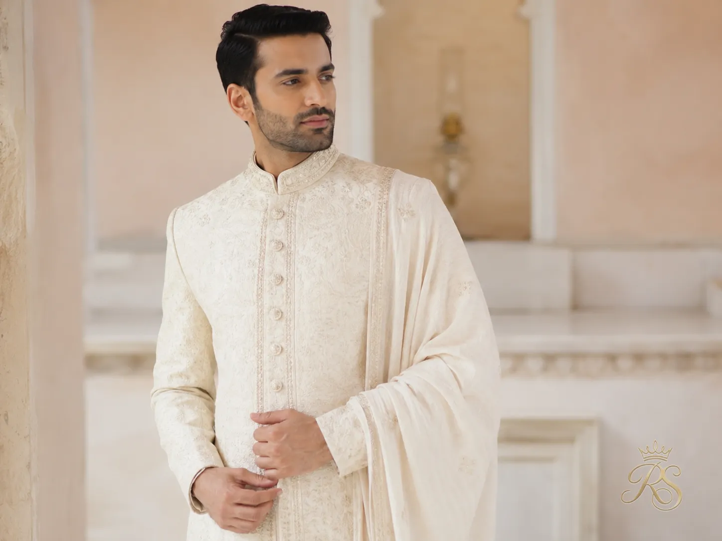 Light ivory sherwani with delicate embroidery ideal for warm-weather weddings